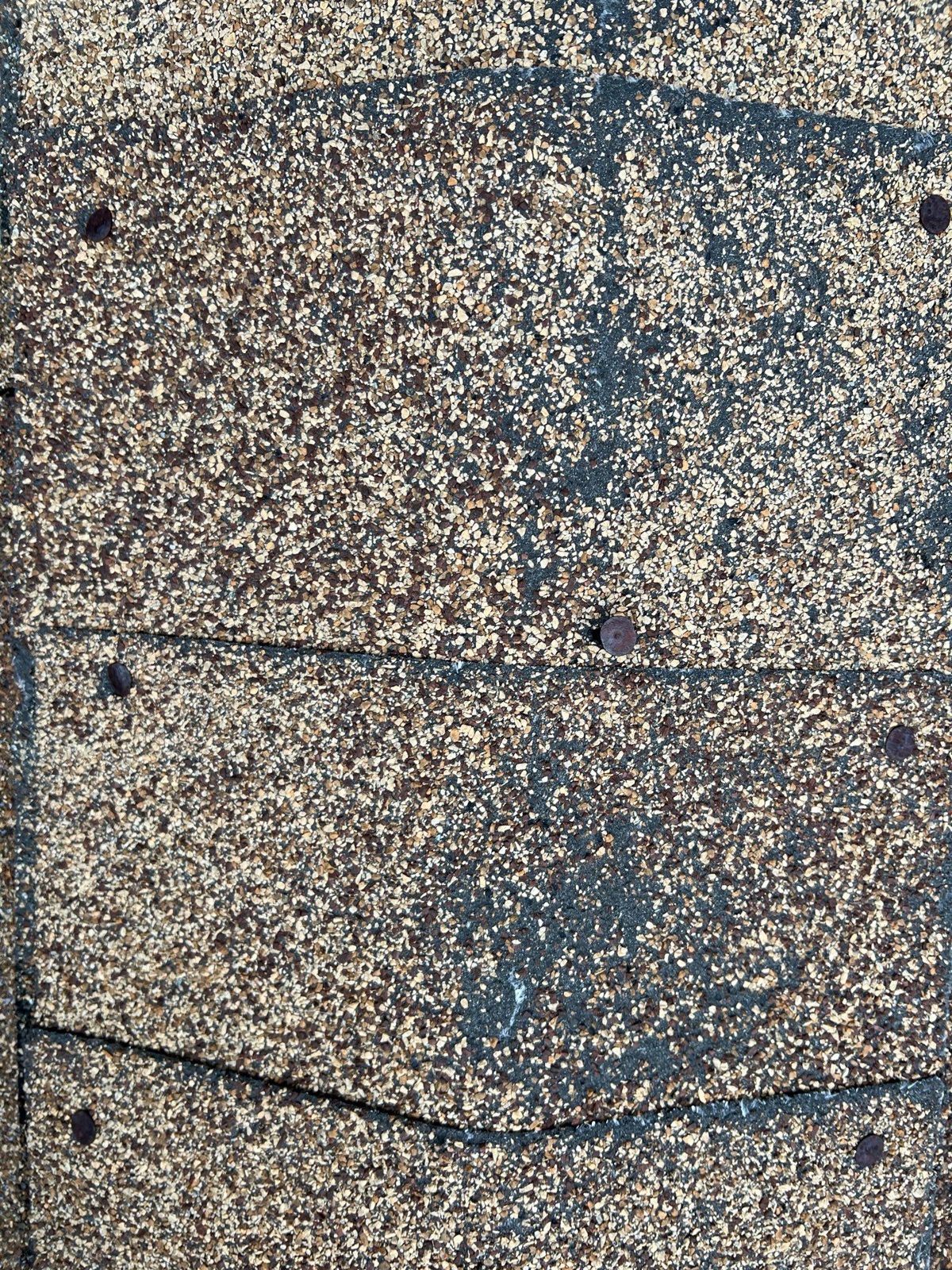 Close-up of a weathered shingle surface
